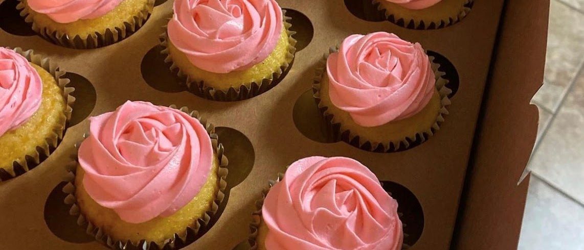 Cupcakes piped with pink frosting roses